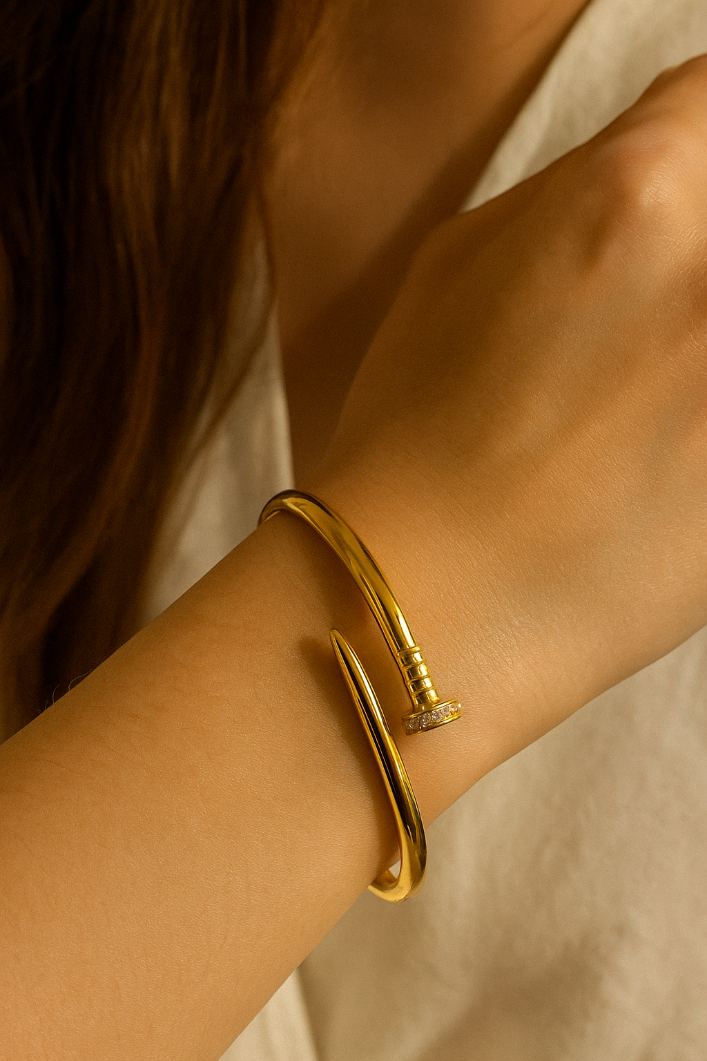 Sleek Nail Twist Stainless Steel Bracelet (Gold Tone)