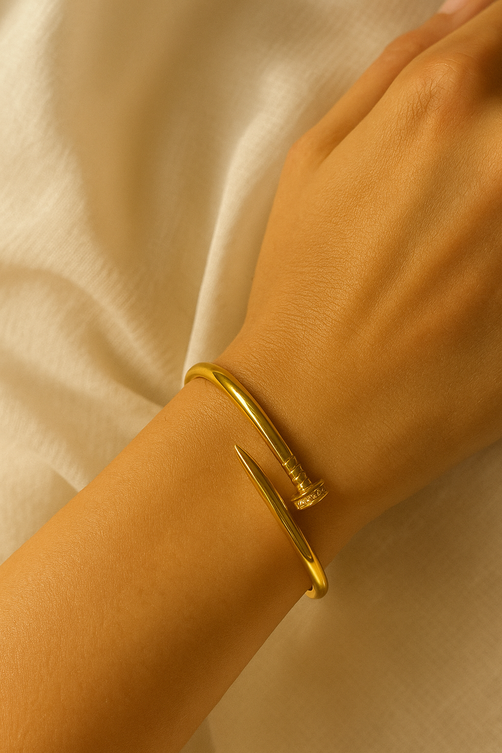 Sleek Nail Twist Stainless Steel Bracelet (Gold Tone)