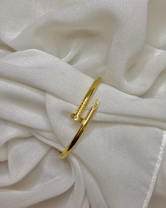 Sleek Nail Twist Stainless Steel Bracelet (Gold Tone)